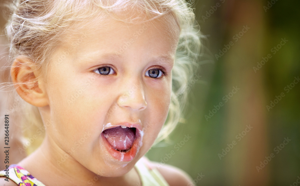 Cute Little Girl Child With Traces Of Ice Cream On Her Face On A Colorful Background. Unique ...