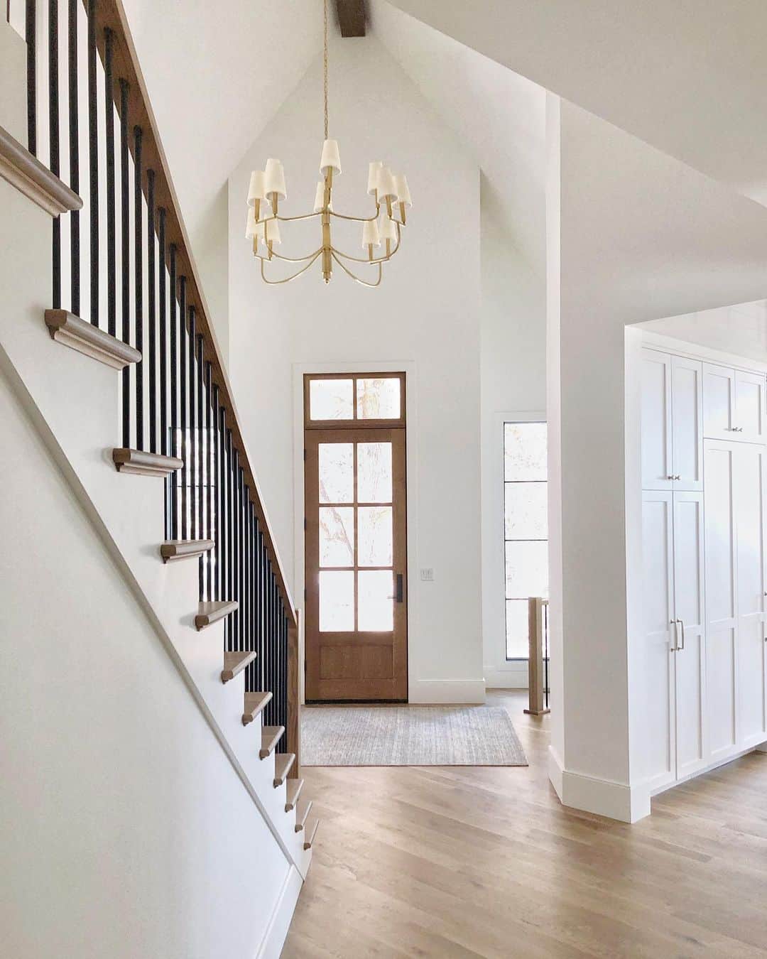 Vaulted Entryway With Gold Light Fixture - Soul & Lane