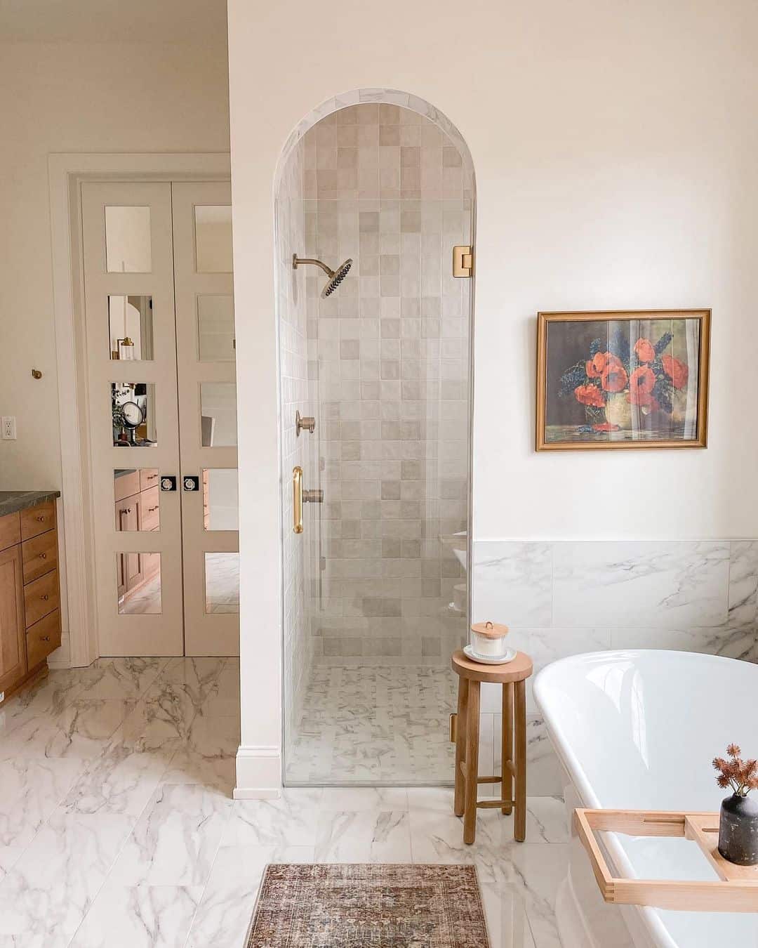 Marbled Bathroom With Arched Shower Entrance - Soul & Lane