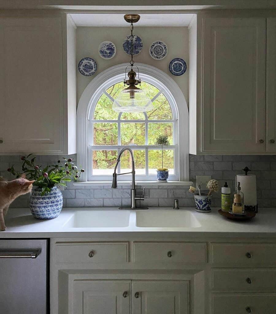 Decorative Ceramic Plates Over Arched Window - Soul & Lane